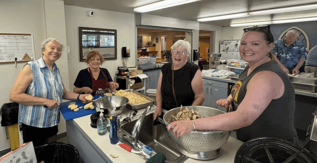 Members of Tordenskjold Lodge No.5 preparing potatoes for lefse making.